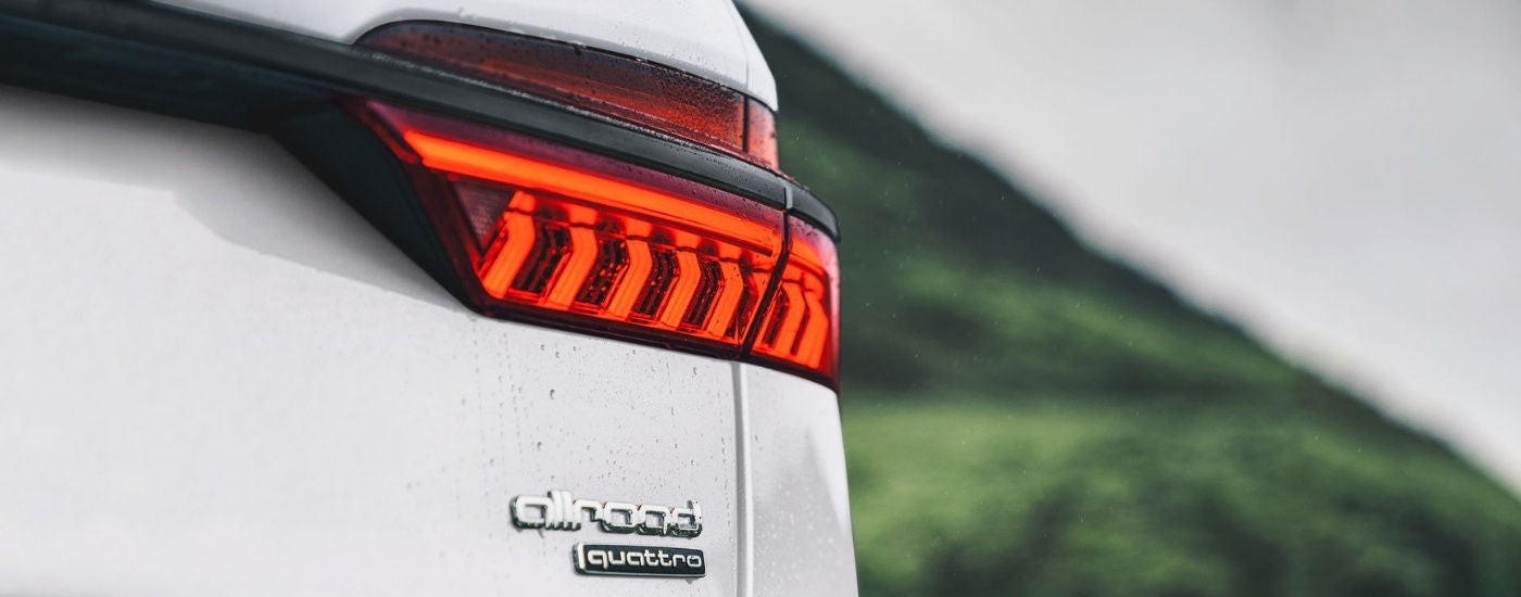 Passenger side taillight on a white 2024 Audi A6 allroad.